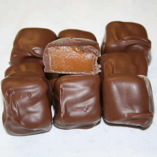 Milk chocolate covered caramels hand-dipped in Mantorville, Minnesota, showcasing artisanal caramel chocolates with smooth, rich texture and free shipping.