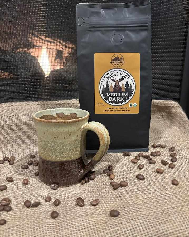 Moose Magic organic medium dark roast coffee bag with moose design and free shipping text